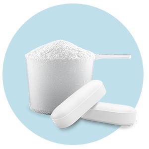 scoop of powder and two white pills on blue circle