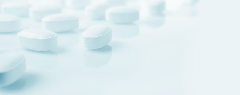 scattered pills with blue overlay