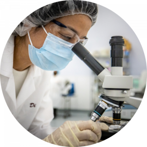 woman inspecting microscope